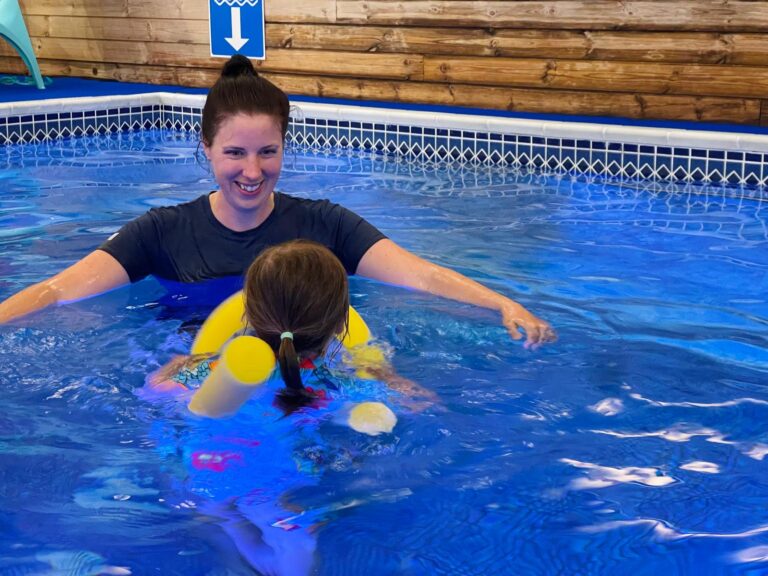 Faye teaching swimming