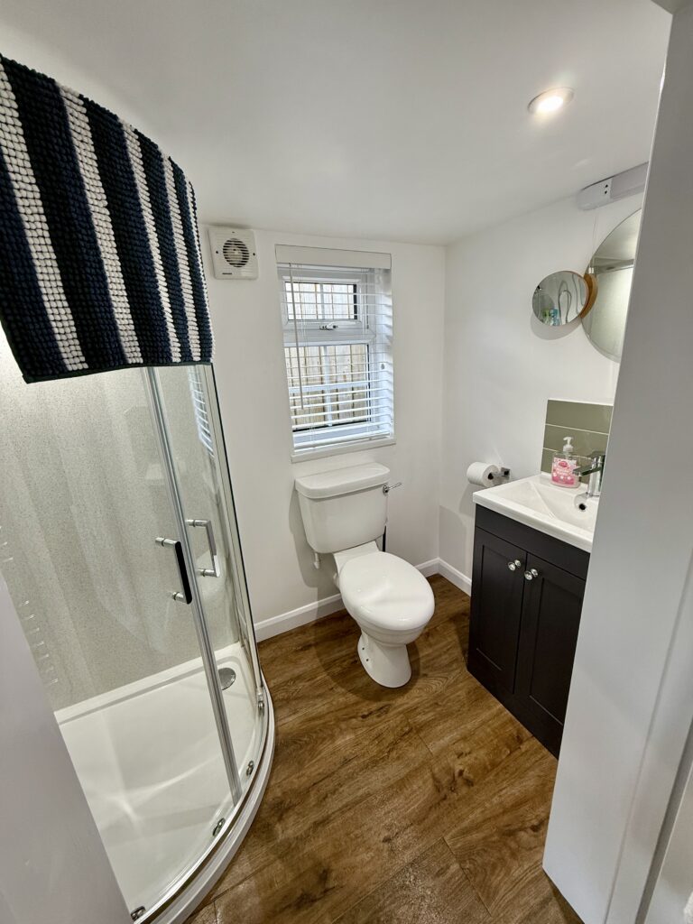 Bathroom with new window and white blinds